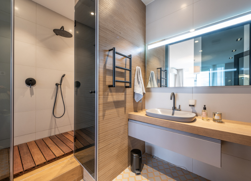Modern wet room with open shower and timber vanity