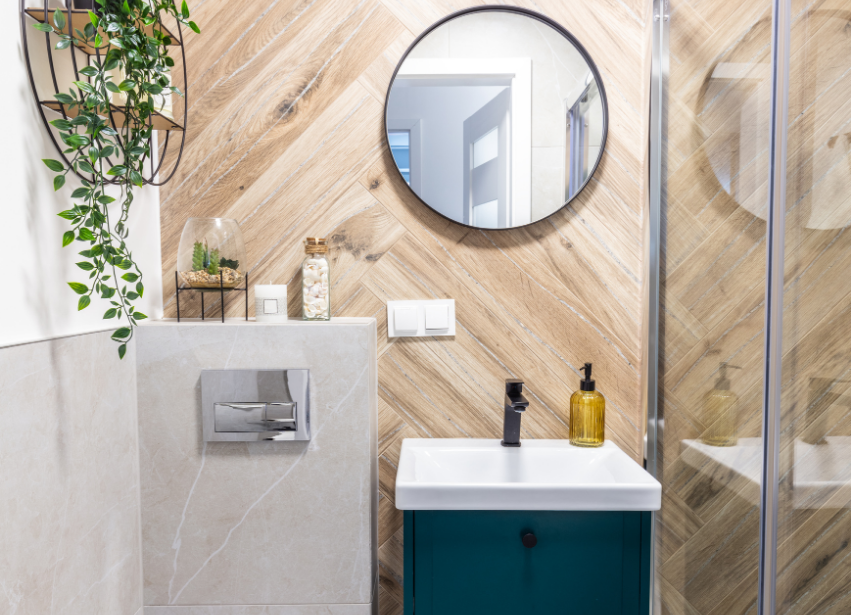 Renovated bathroom with timber herringbone wall and compact vanity